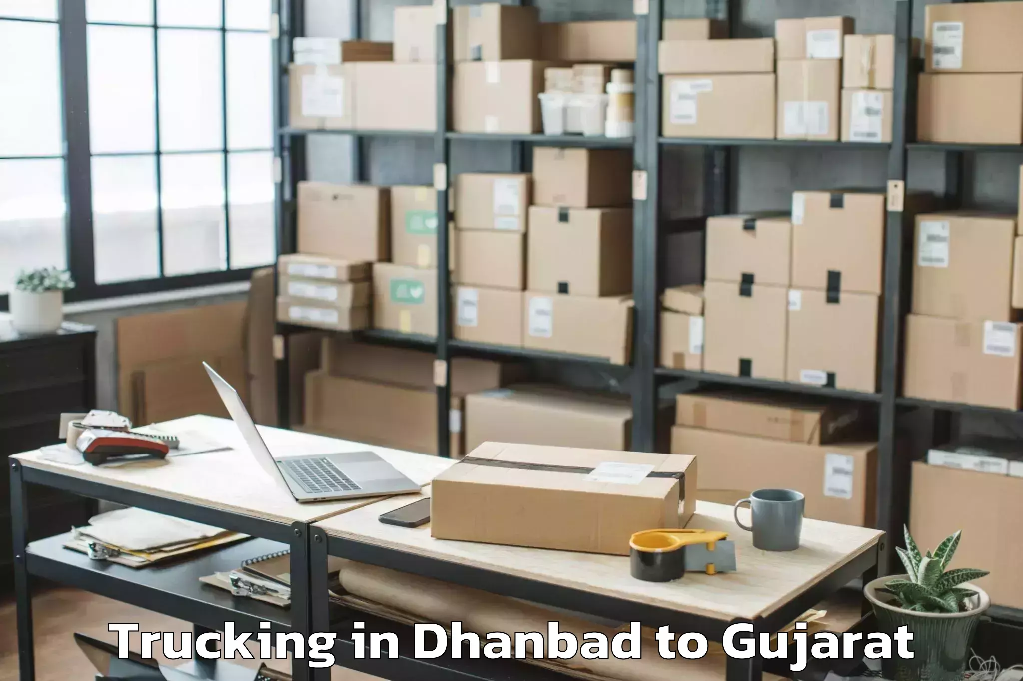 Book Dhanbad to Vanthali Trucking Online